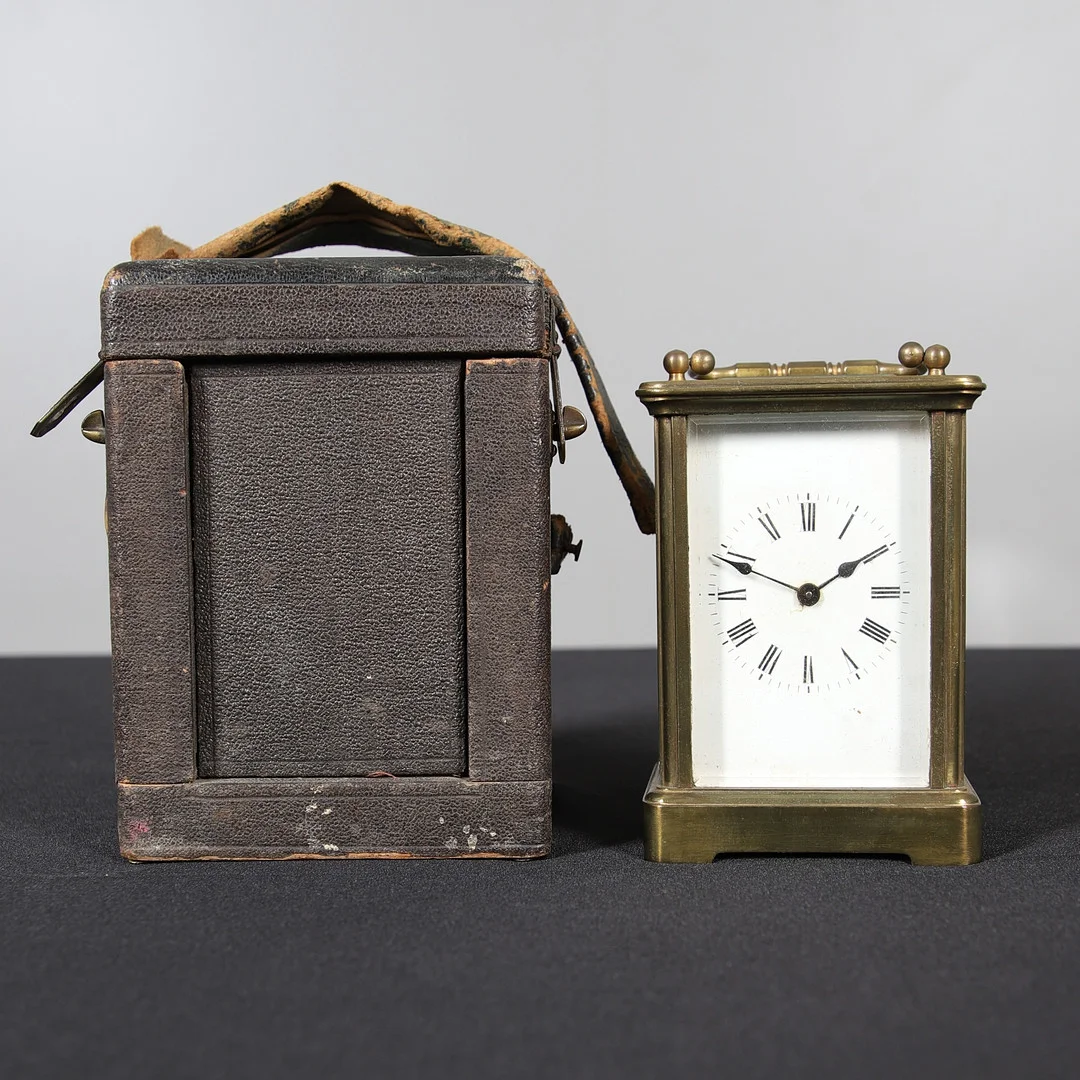 AN EARLY 20TH CENTURY BRASS CASED CARRIAGE TIMEPIECE. — Carriage & Miniature Clocks — Lawrences Auctioneers