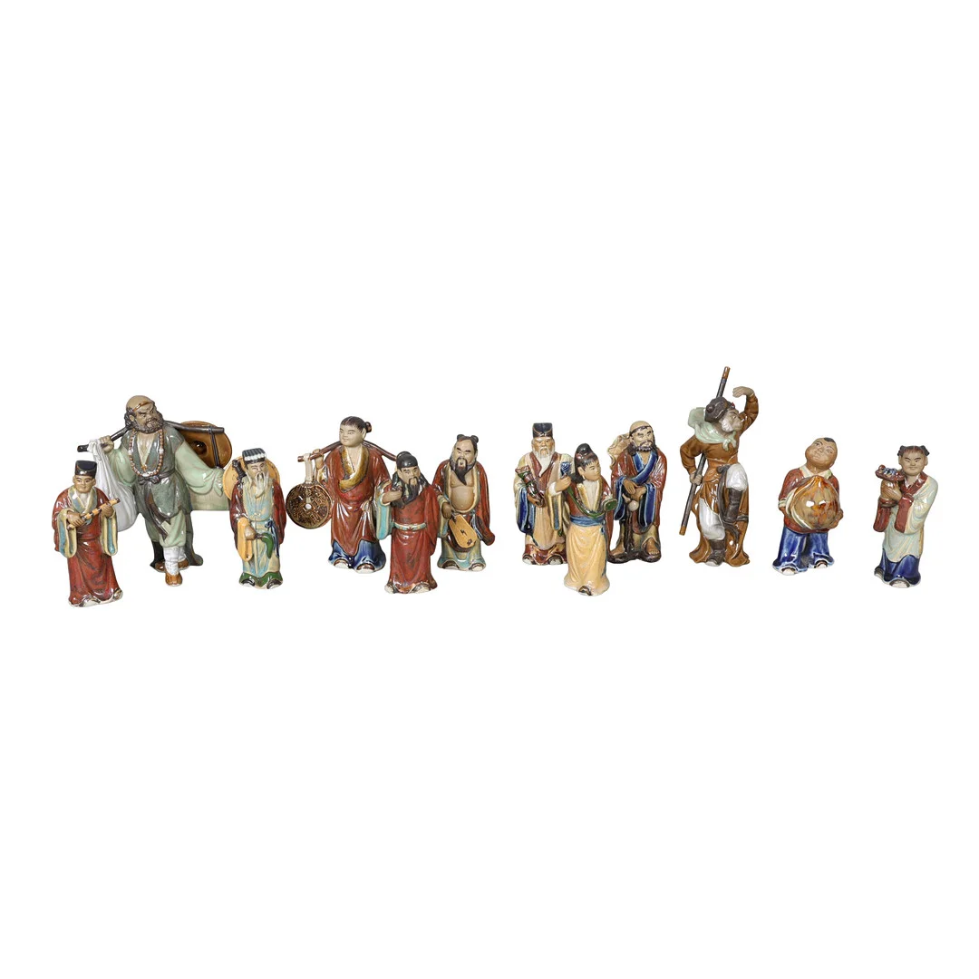 A COLLECTION OF CHINESE POTTERY FIGURES (12). — Ceramics & Porcelain — Bishop & Miller