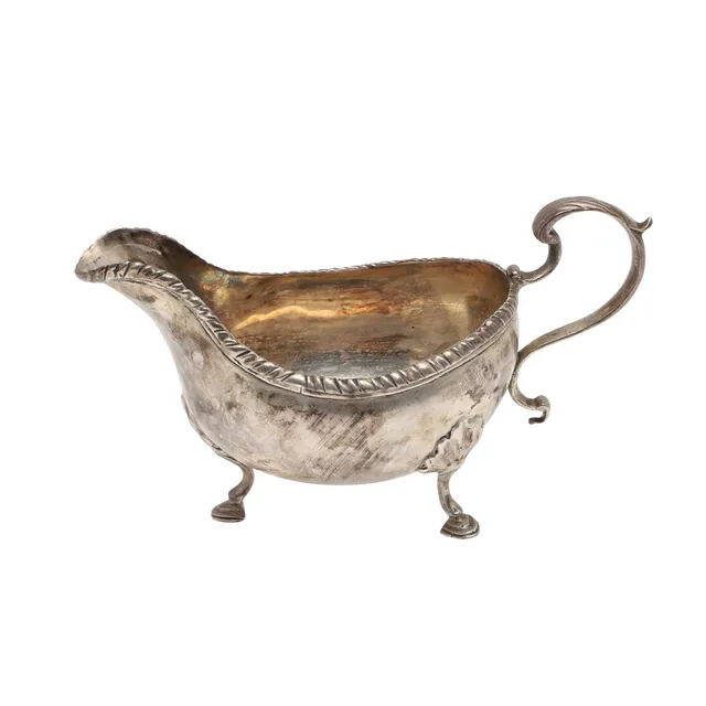 AN EARLY GEORGE III SILVER SAUCE BOAT.
