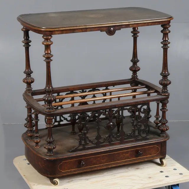 A VICTORIAN WALNUT CANTERBURY.