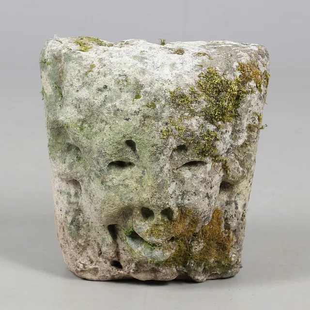 A MEDIEVAL CARVED STONE CORBEL.