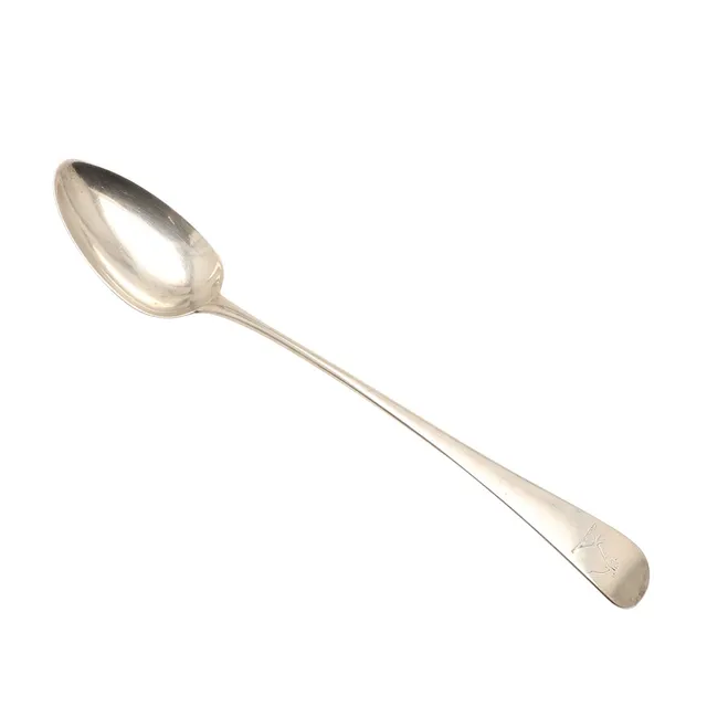 A GEORGE III SILVER OLD ENGLISH PATTERN SERVING SPOON.