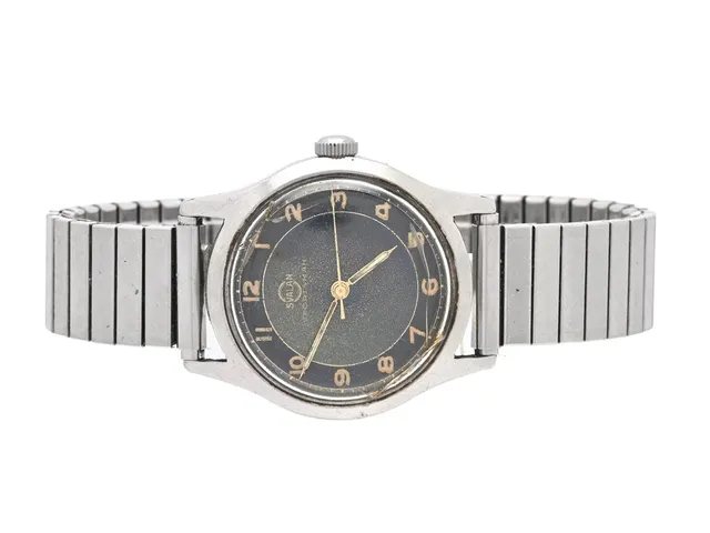 SVALAN, Sportsman, Cal 130, Boett nr. 130923 / 1855 / 5012, herrur, 33 mm, stål, manuell, plexiglas, skadad urtavla, ca 1950, metallänk ej original.