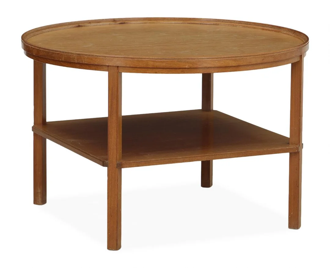 “Rygebord”. Circular coffee table in mahogany with moulded edge and shelf below. Made and marked by Rud. Rasmussen. H. 52 cm. Diam. 80 cm. — Modern Furniture — Bruun Rasmussen