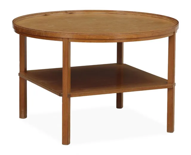 “Rygebord”. Circular coffee table in mahogany with moulded edge and shelf below. Made and marked by Rud. Rasmussen. H. 52 cm. Diam. 80 cm.