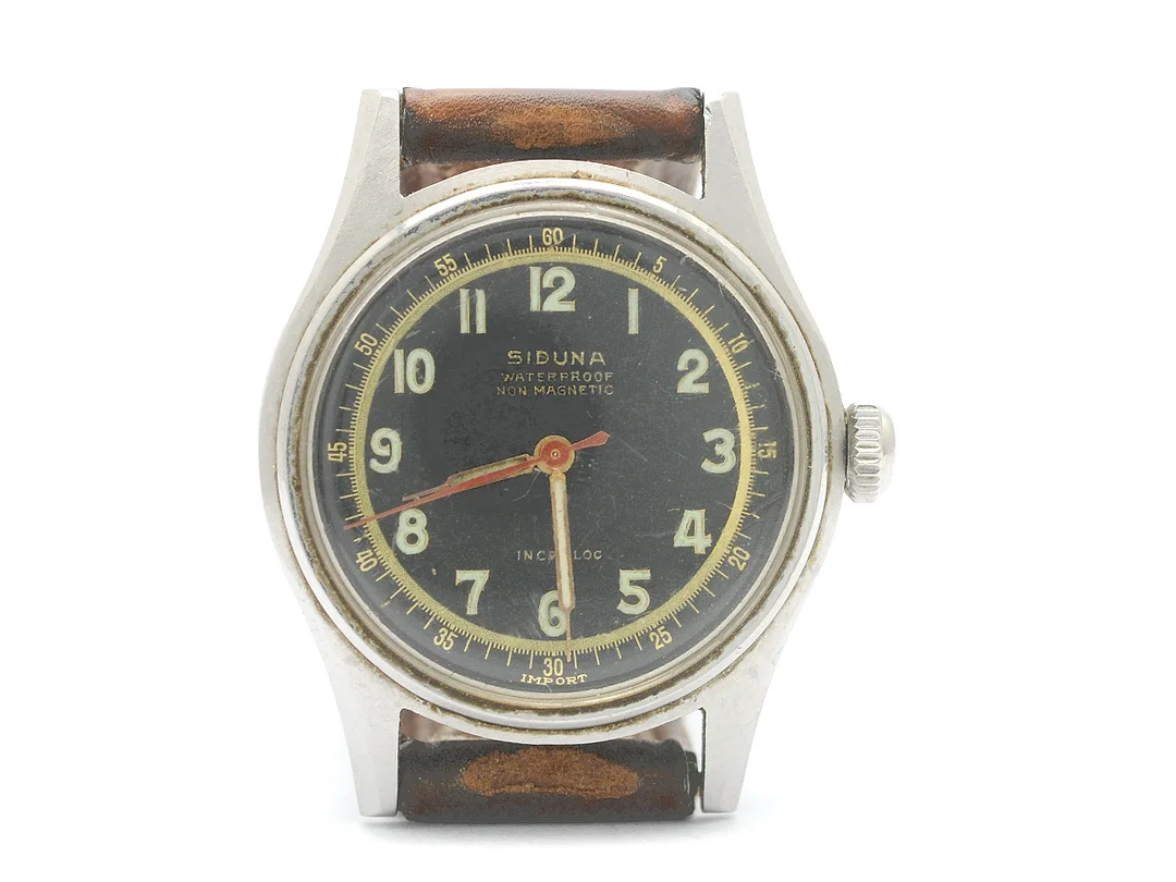 SIDUNA, herrur, 31,5 mm, Boett nr. 258503, stål, manuell, plexiglas, skadad urtavla, läderband, ca 1958. — Klockor/Siduna — Kaplans