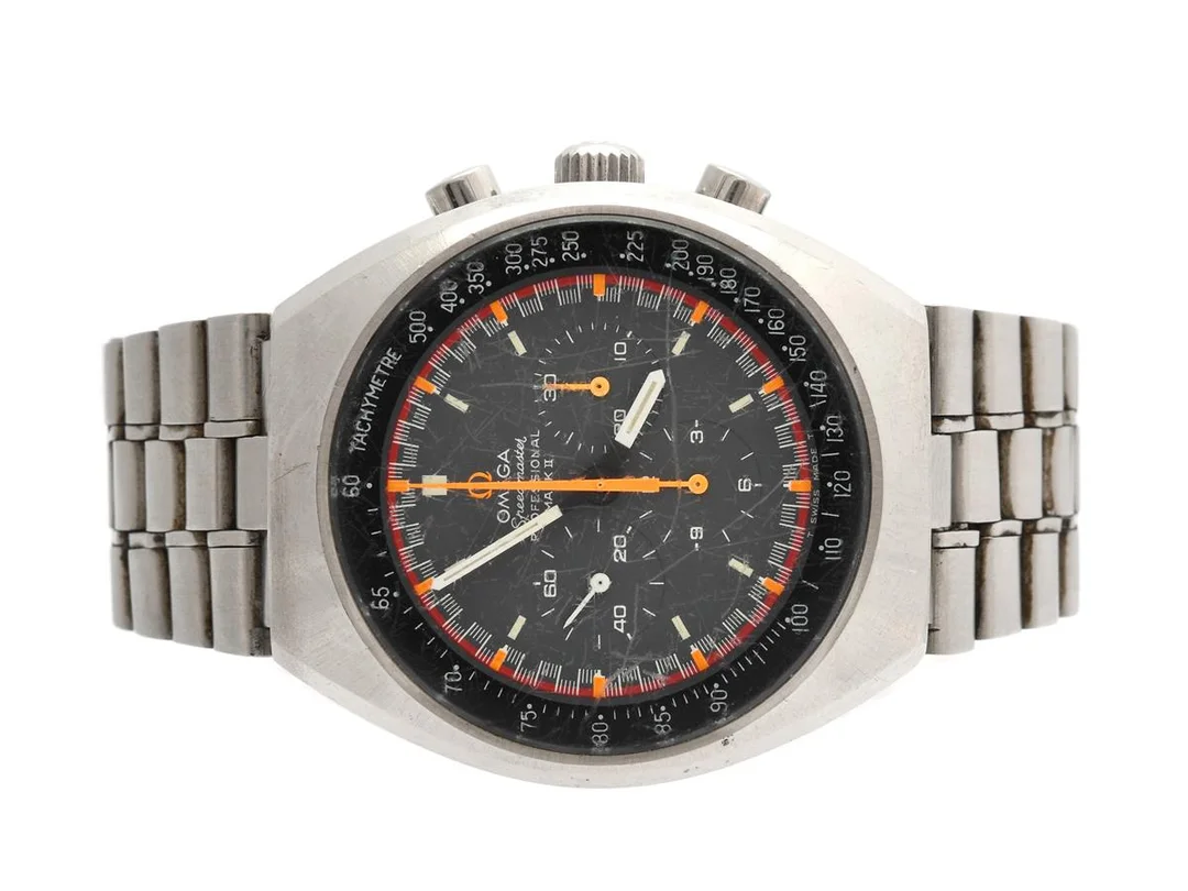 OMEGA, Speedmaster Professional, Mark II (T Swiss Made T), "Tachymetre", s.k. "Racing Dial", Cal 861, Serie nr. 32191438, Ref nr. ST 145,0014, Boett nr. 145.014, kronograf, herrur, 41,5 mm, stål, manuell, mineralglas, defekt (servicebehov/ställaxel lös), originallänk, viklås, Ref nr. 1159/154, ca 1971. — Klockor/Omega — Kaplans
