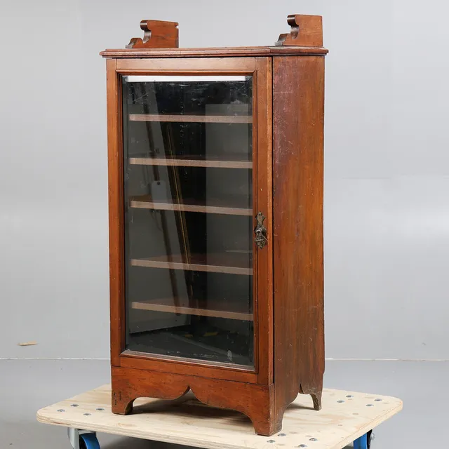 A LATE 19TH CENTURY WALNUT MUSIC CABINET.