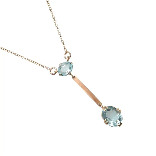 A GOLD AND TURQUOISE PASTE SET PENDANT.