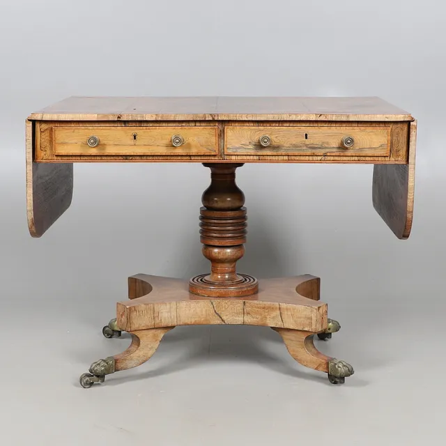 A REGENCY ROSEWOOD AND SATINWOOD STRUNG SOFA TABLE.