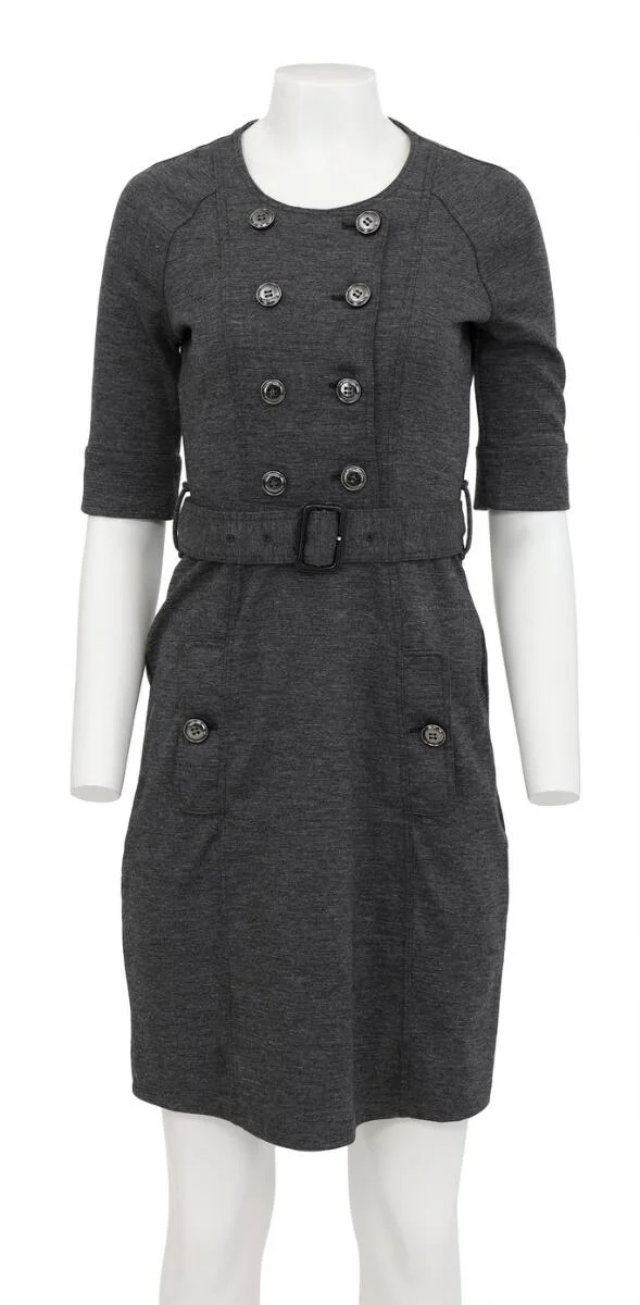 A grey dress of wool with buttons on the front, two pockets and a belt. Length app. 96 cm, across chest 80 cm. Size M. — Designer Handbags & Fashion — Bruun Rasmussen