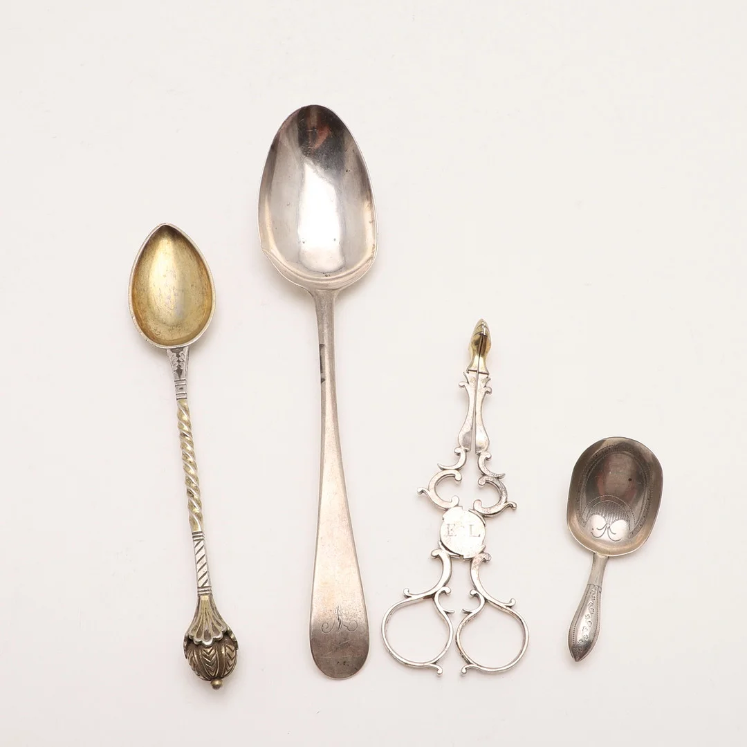 A GEORGE III CADDY SPOON. — Silver — Lawrences Auctioneers