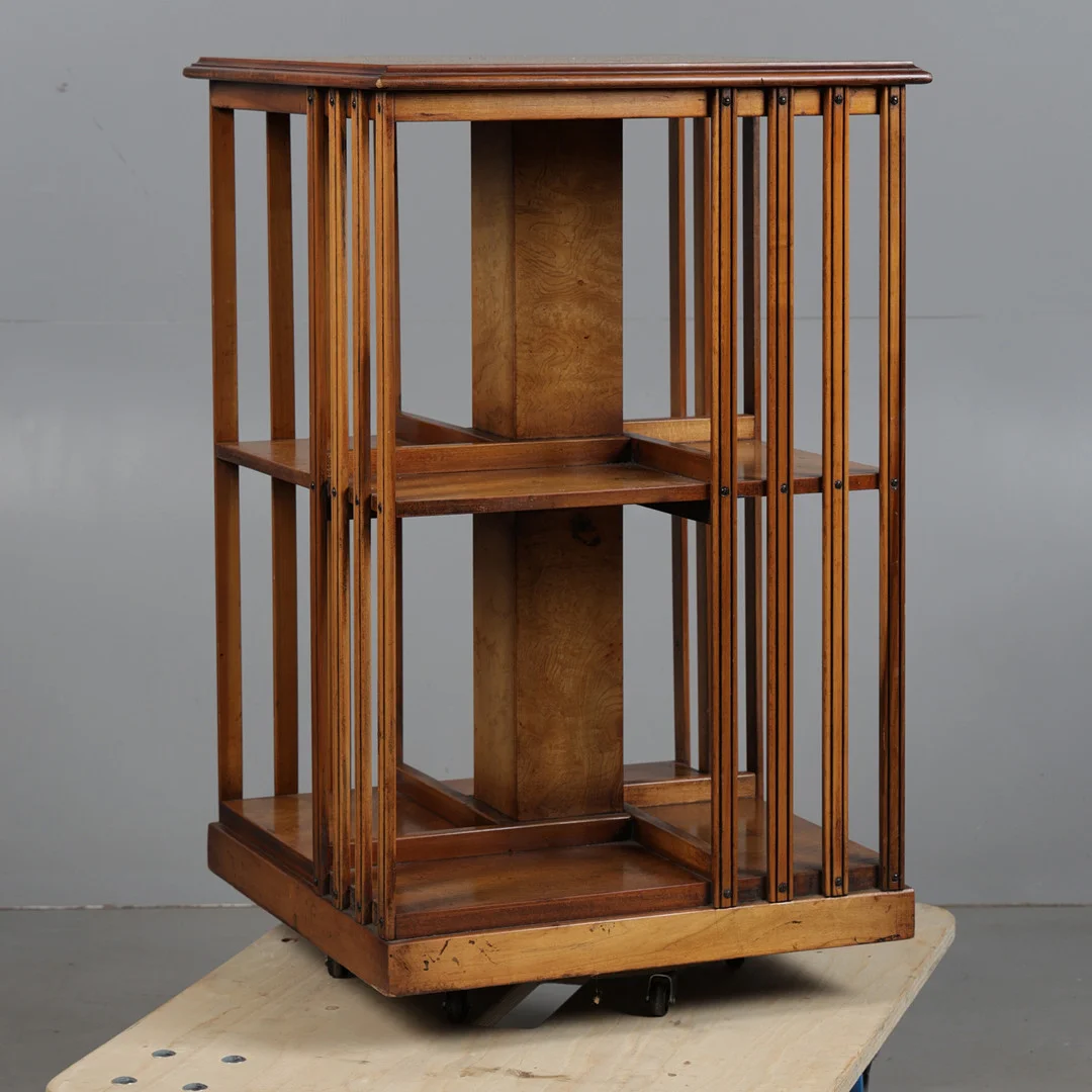 AN EDWARDIAN SHERATON REVIVAL REVOLVING BOOKCASE. — Cupboards, Cabinets & Shelves — Bishop & Miller