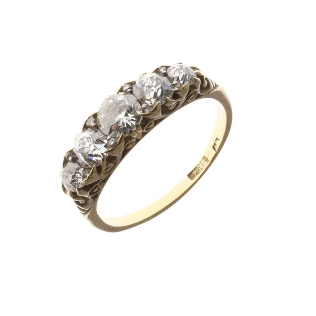 A DIAMOND HALF HOOP RING.