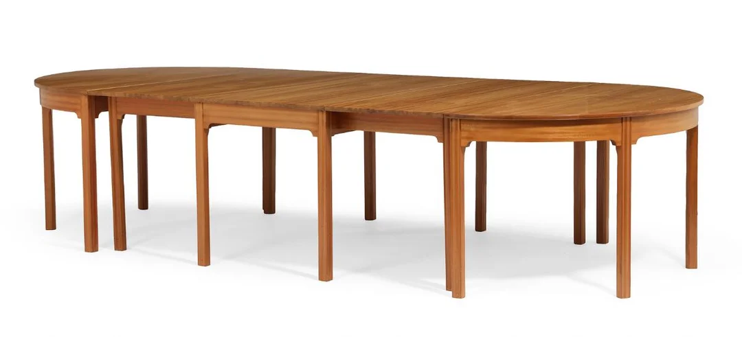 Conference table of solid mahogany, consisting of two D-ends and table with two flip up leaves. Made and marked by Rud. Rasmussen Cabinetmaker's. H. 75 cm. Maximum Length. 331 cm. W. 146 cm. (3) — Modern Furniture — Bruun Rasmussen