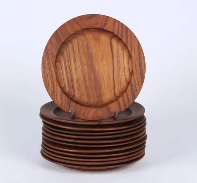 Kay Bojesen. Set of twelve teak plates (12)