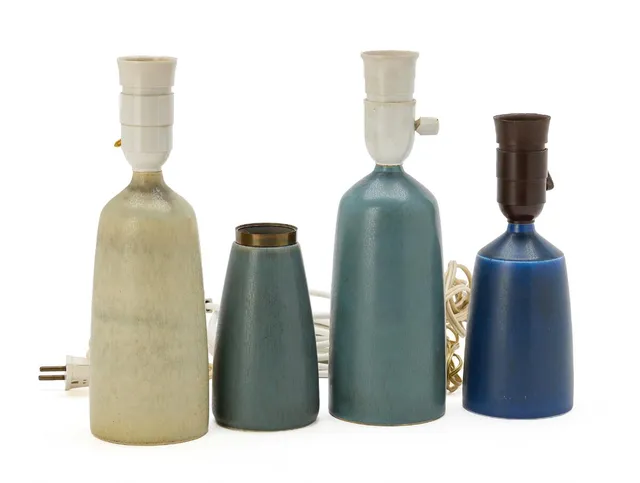 Four small table lamps of stoneware, decorated with light grey and blue glaze. Made and signed by Palshus, Denmark. One additionally marked Le Klint. H. including socket 14–26 cm. (4)