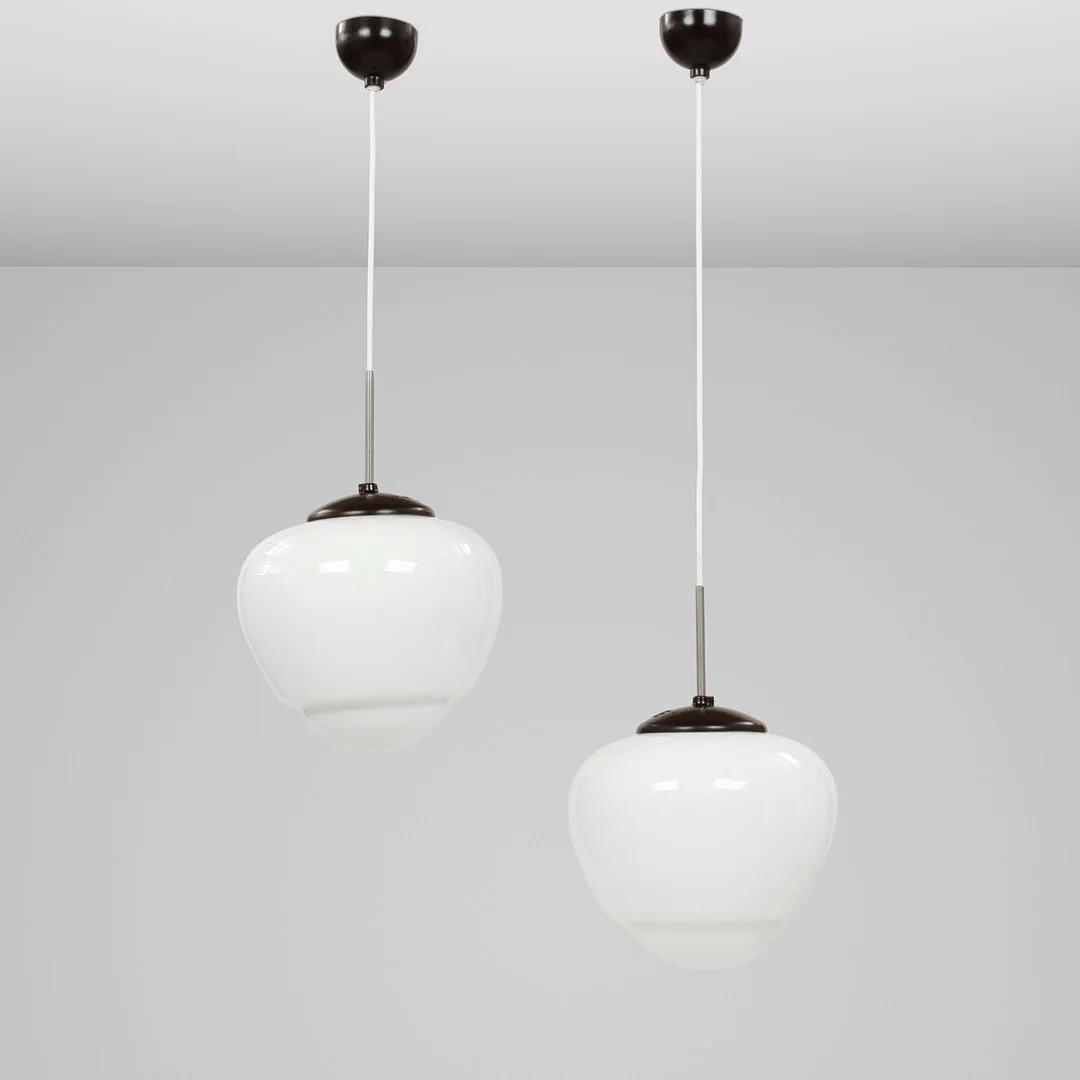 To Loftspendler af mælkehvidt opalglas med bakelit montering, 1960'erne. Tjekkiet (2). — Ceiling lights — Palsgaard Kunstauktioner