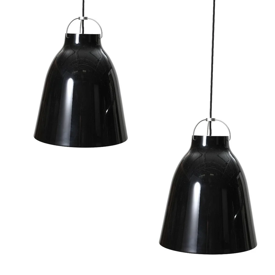 “Caravaggio". A pair of black lacquered metal pendants, inside white lacquered. Manufactured and marked by Lightyears. H. 51.6. Diam. 40 cm. (2) — Modern Lighting — Bruun Rasmussen