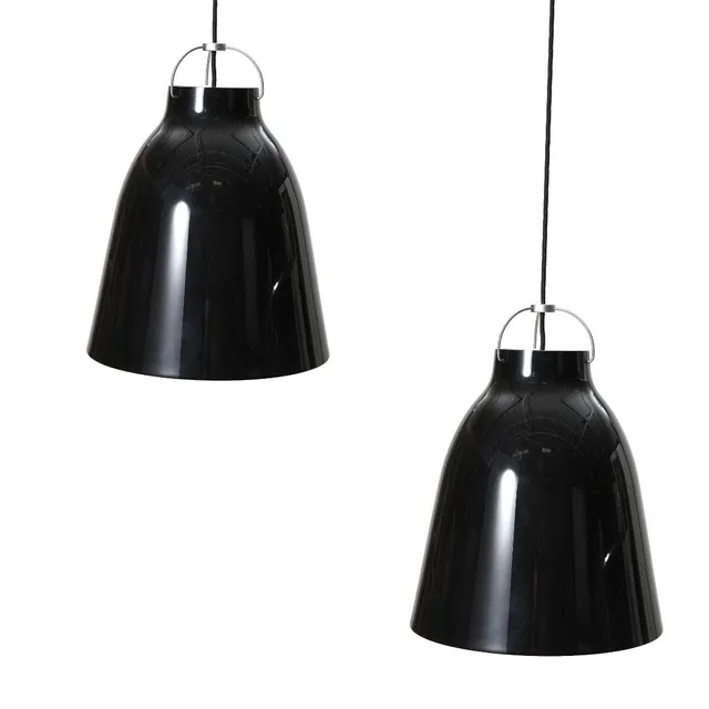 “Caravaggio". A pair of black lacquered metal pendants, inside white lacquered. Manufactured and marked by Lightyears. H. 51.6. Diam. 40 cm. (2)