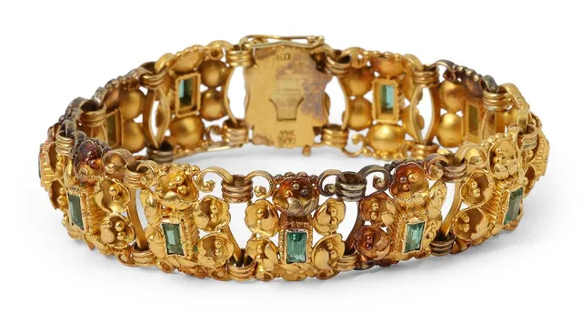 An emerald bracelet set with numerous emerald-cut emeralds, mounted in 14k gold. Weight app. 47.5 g. W. 17 mm. L. 18.5 cm.