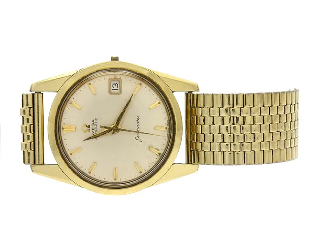 OMEGA, Seamaster, Cal 562, Serie nr. 17617664, Ref nr. KO 14701, Boett nr. 14701 4 SC (C.B), herrur, 33,5 mm, guld på stål, automatisk, plexiglas, datum, skadad urtavla, defekt, krona/ställaxel saknas, OBS: lösa delar i urverk, ca 1960.