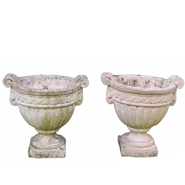 A PAIR OF RECONSTITUTED STONE TWIN-HANDLED URNS.