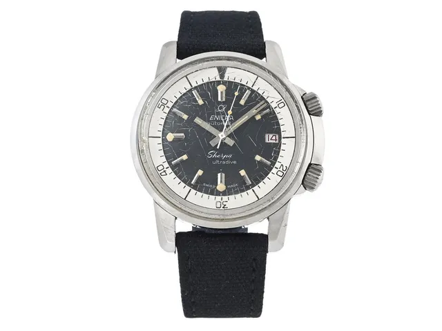 ENICAR, Sherpa Ultradive (Swiss T Made), "Compressor Case", Cal AR 1145, Serie nr. 720369, Boett nr. 144/35/03, herrur, 40 mm, stål, automatisk, plexiglas (skadat), datum, vridbar innerring, tyg/läderband, ca 1966.