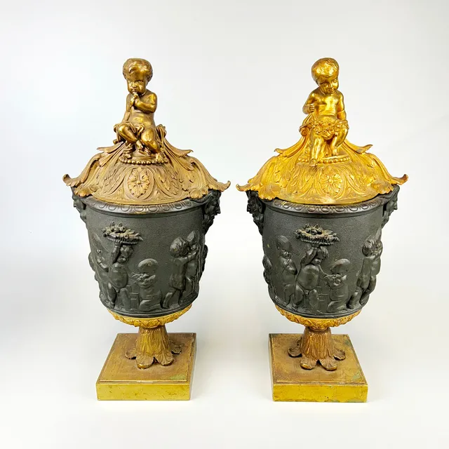 BRONZE PUTTI URNS.