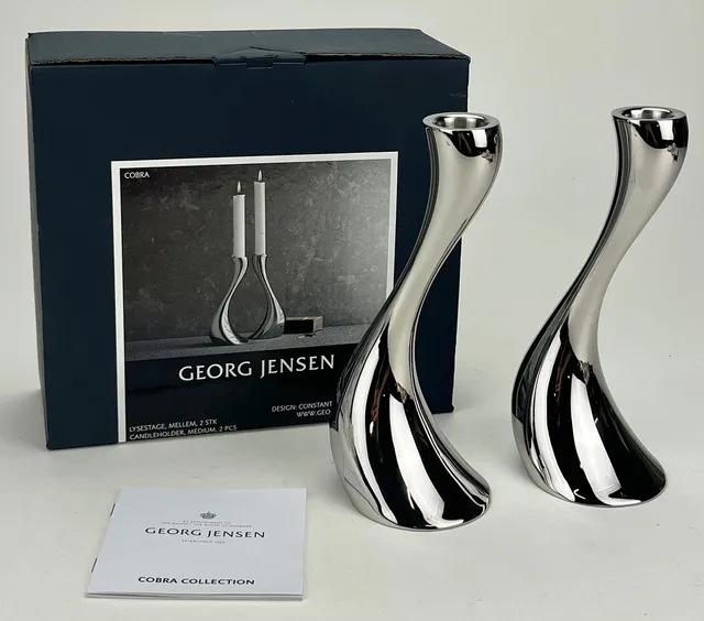 CONSTANTIN WORTMANN. Ljusstakar, ett par, stål, "Cobra medium", Georg Jensen, Danmark.