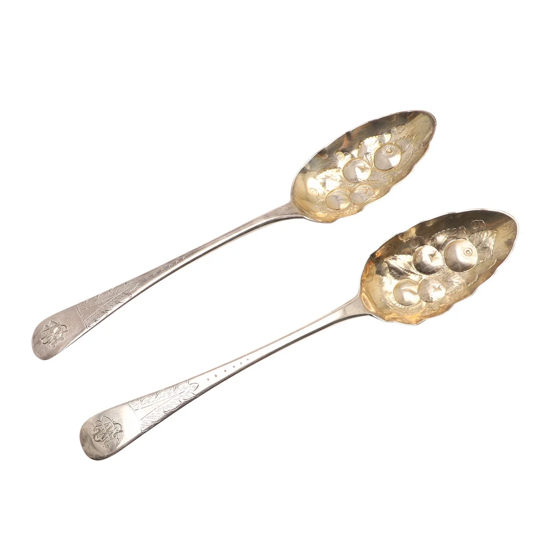 A PAIR OF GEORGE III BERRY SERVING SPOONS. — Silver — Lawrences Auctioneers