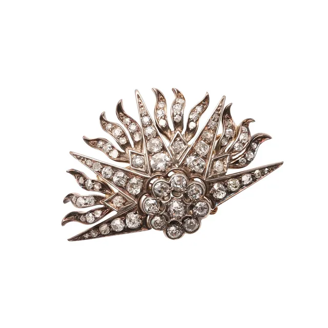 A VICTORIAN RISING SUN BROOCH.