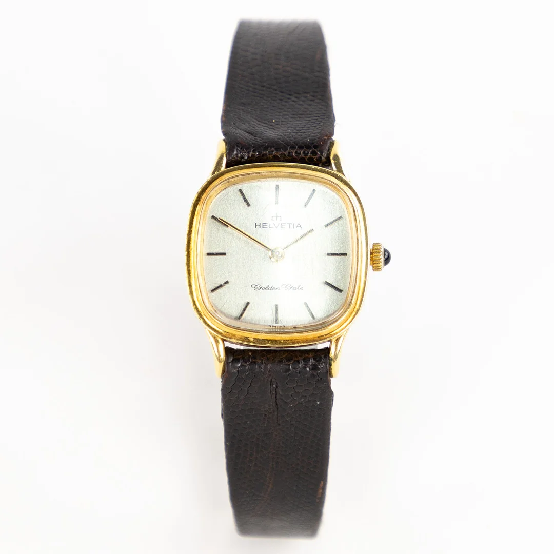 HELVETIA. Golden Gate, 23,5 mm, 18k guld, 80-tal. — Wristwatches — Karljohan Auktioner