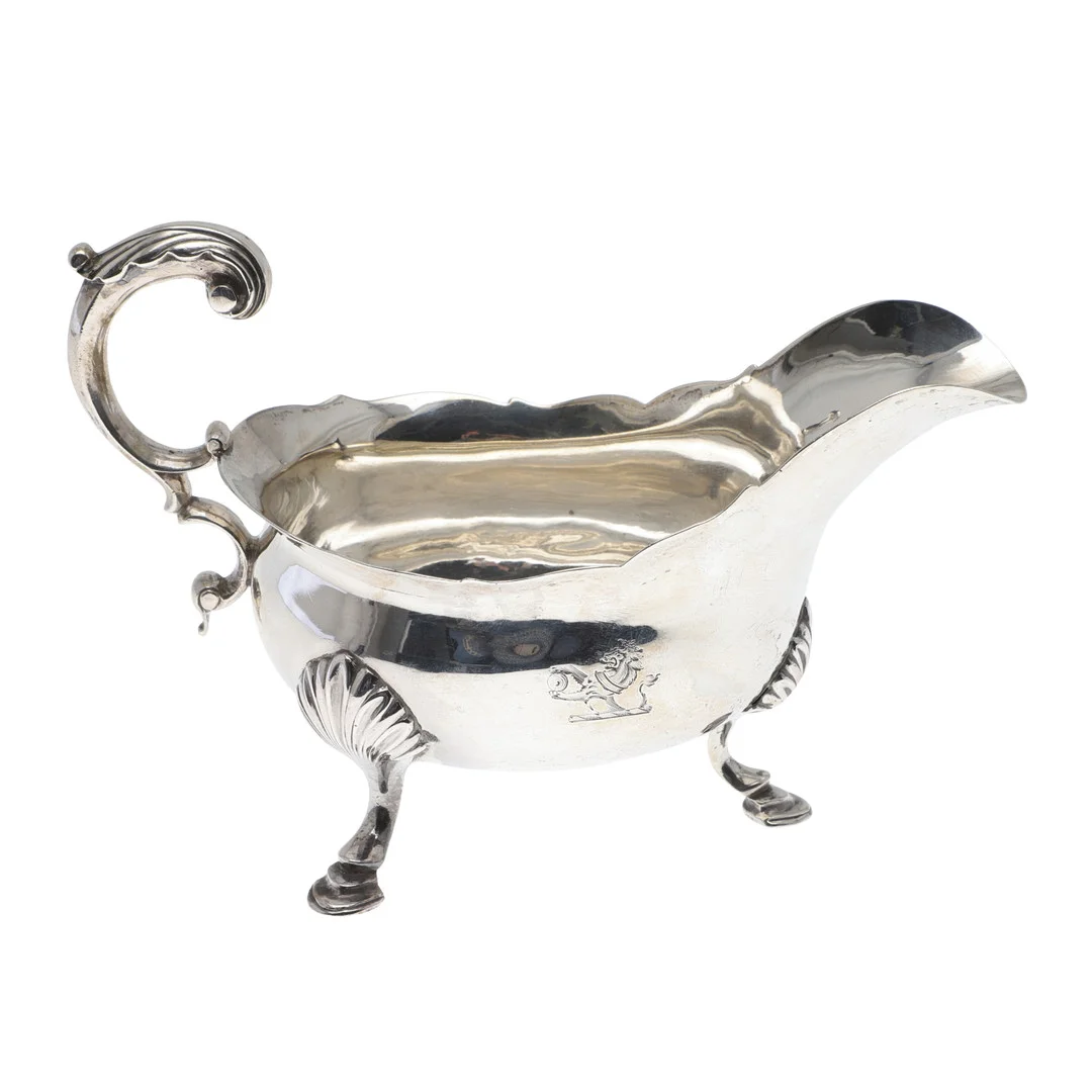 A GEORGE III SILVER SAUCE BOAT. — Silver — Lawrences Auctioneers