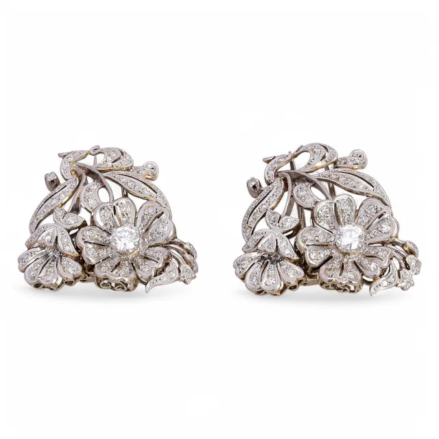 Pair of diamonds clip brooches, mid 20th Century.