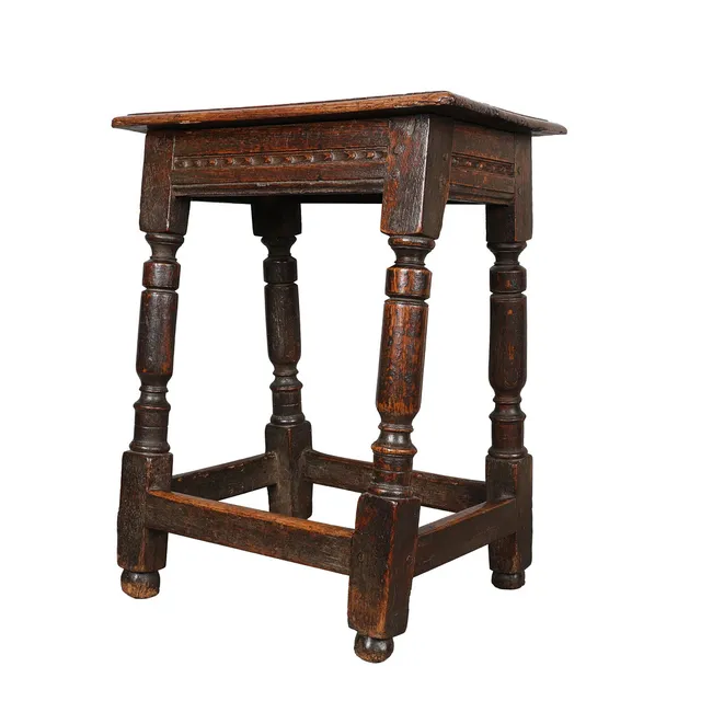 A 17TH CENTURY OAK JOINT STOOL.