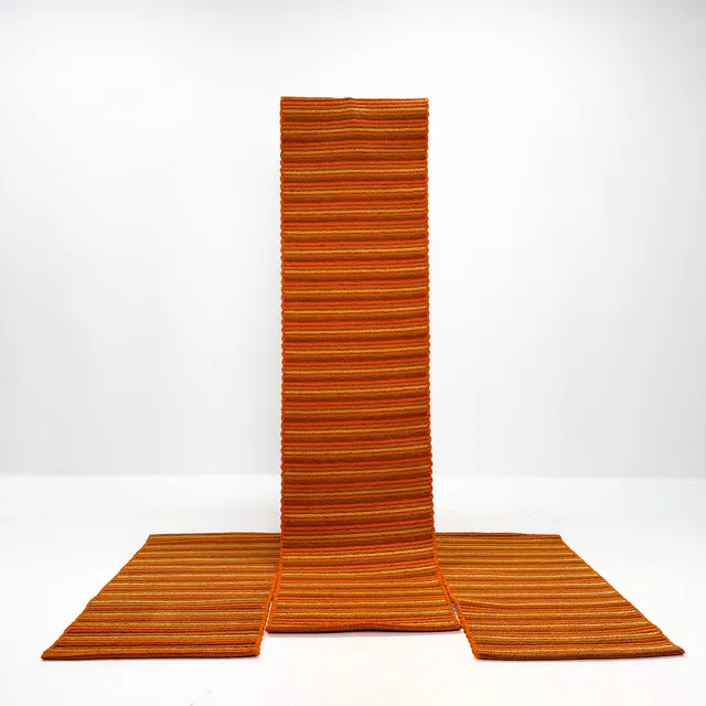 MATTOR 3 st, vävda i orange textil, 1900-talets mellersta del.
