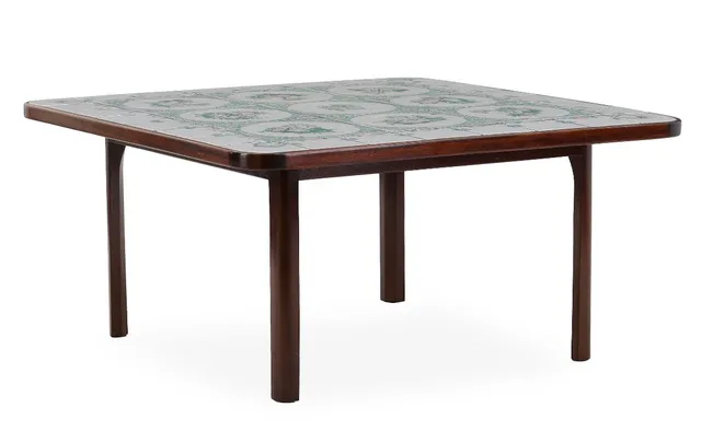 Square coffee table with mahogany frame. Top with tiles in green, light and pink shades. Sign. Bjørn Wiinblad april 1976. H. 49.5. L./W. 101.5.