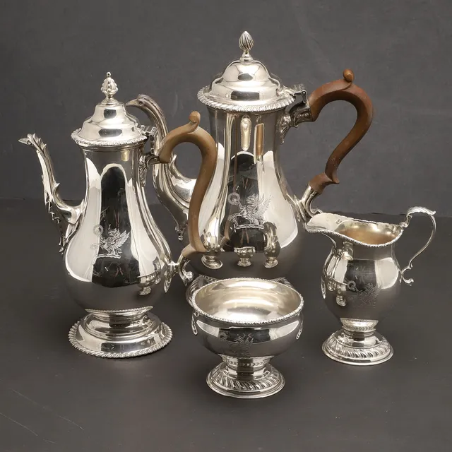 AN ELIZABETH II FOUR PIECE SILVER MATCHED COFFEE SET.