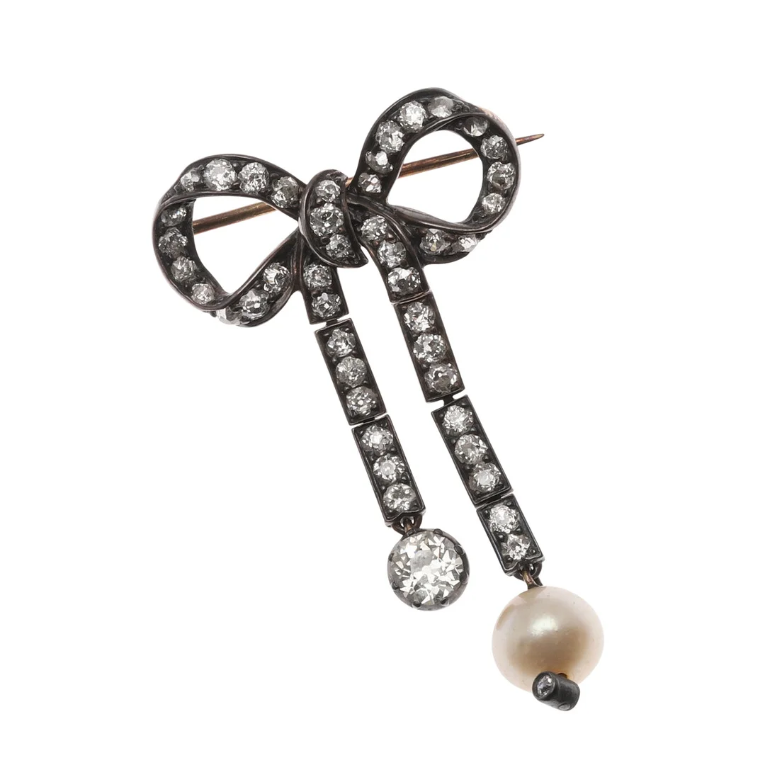 A VICTORIAN DIAMOND AND PEARL BOW BROOCH. — Brooches & Pendants — Lawrences Auctioneers