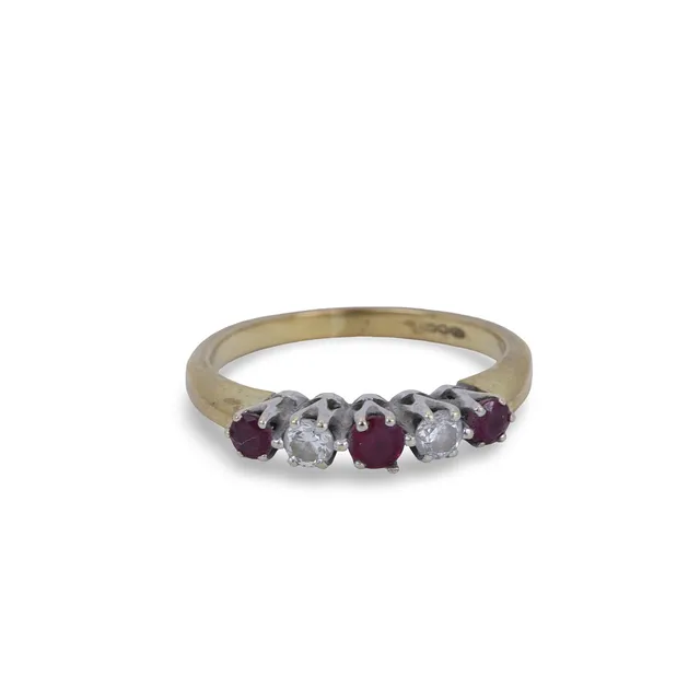RUBY AND DIAMOND HALF ETERNITY RING.