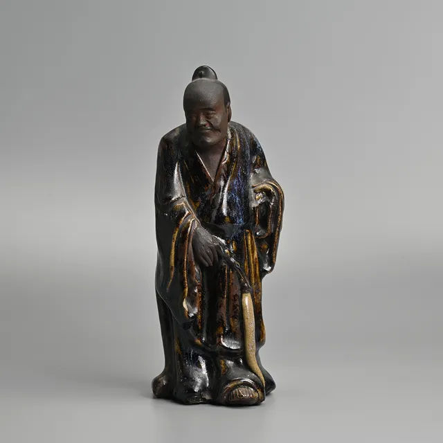 A CHINESE SHIWAN FLAMBE GLAZED POTTERY FIGURE, EARLY 20TH CENTURY.