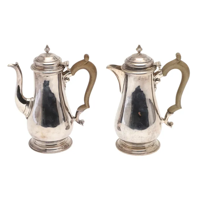 A 1930'S SILVER COFFEE POT AND HOT WATER POT.