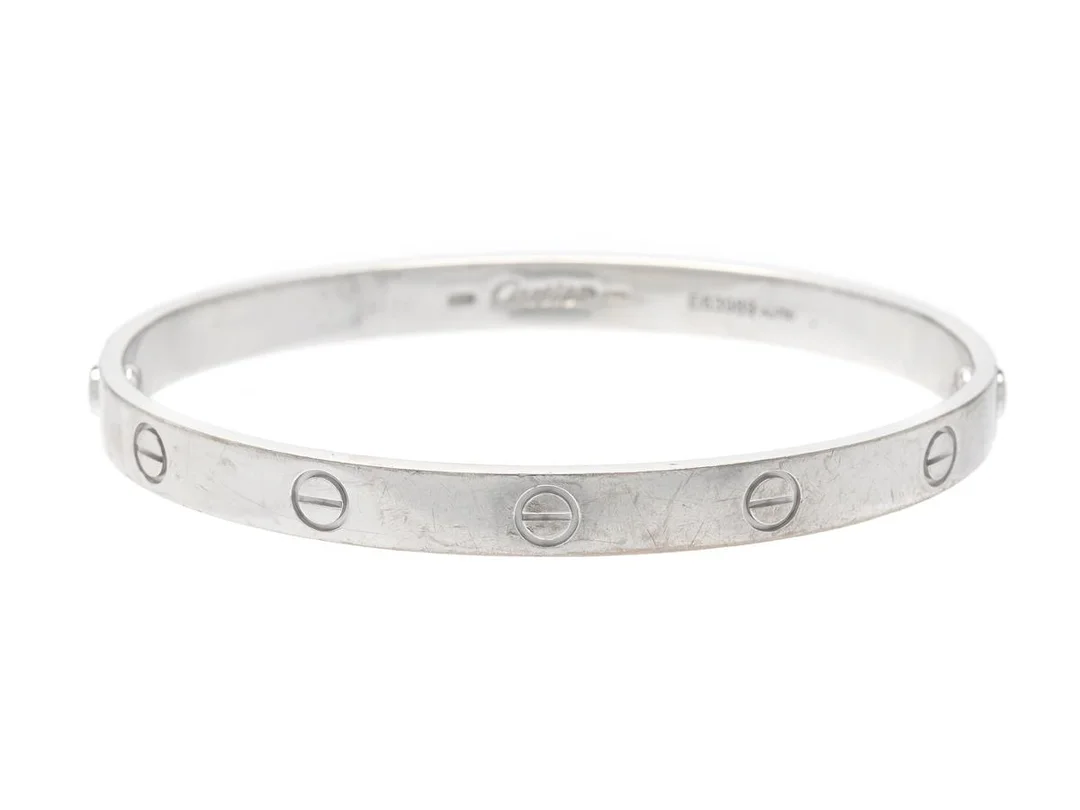 CARTIER, armband, Love bracelet,18K vitguld, ref. nr E63989, 1993, stl 19, vikt 37,2 g, skruvmejsel, slitage, reseetui. — Smycken/Armband — Kaplans