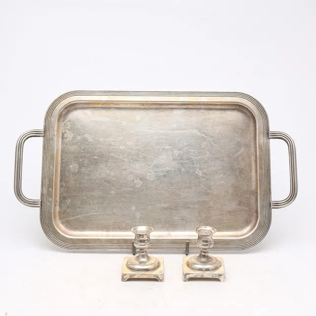 Tray and pair of candlesticks in silvery metal, first half of the 20th Century.