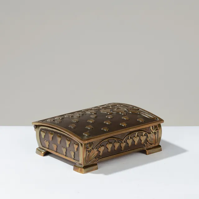 NIELS DAM RAVN: Box in partially dark patinated ore decorated with leaf vines in high relief, Nordisk Metalkunst, Denmark, Nordic Art Deco, mid-20th century.