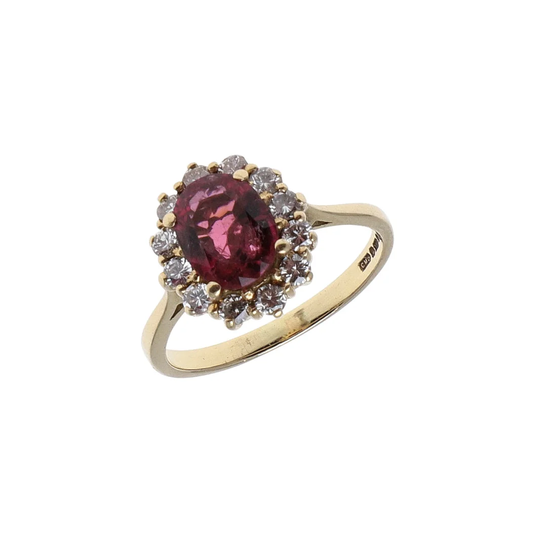 A PINK TOURMALINE AND DIAMOND CLUSTER RING. — Rings — Lawrences Auctioneers