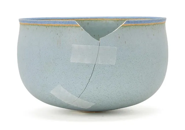 A circular stoneware bowl, decorated with light blue-green glaze, upper rim with blue glaze. Signed alev, F78. With label marked Ege '97, 42. Unique. H. 11 cm. Diam. 17.4 cm.