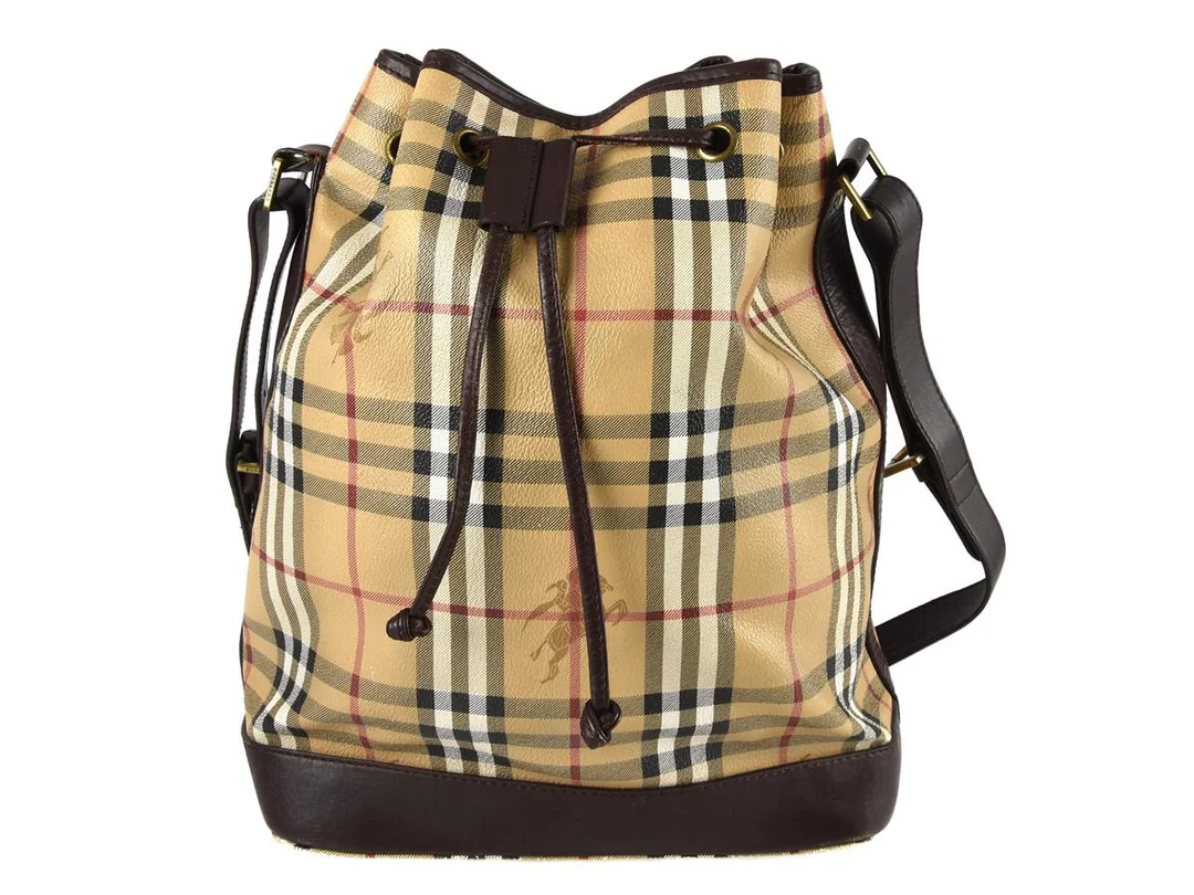 VÄSKA, BURBERRY, Bucket, rutig canvas, brunt läder, 26x34x15cm, visst slitage på hörn. — Accessoarer/Väskor — Kaplans