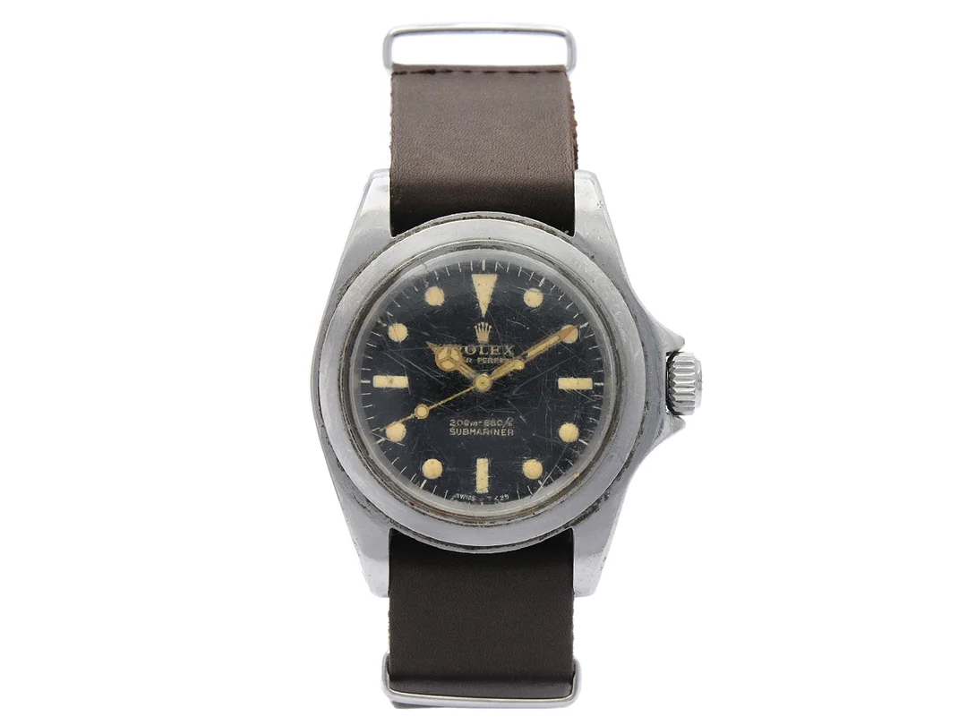 ROLEX, Oyster Perpetual, Submariner (200m=660ft, Swiss-T<25), s.k. "gilt dial, meter first", Ref nr. 5513, Serie nr. 1132552, Cal 1530, Boett nr. 5513, herrur, 39 mm, stål, automatisk, plexiglas, dykring saknas, NATO-band, tillverkad tredje kvartalet 1964. — Klockor/Rolex — Kaplans